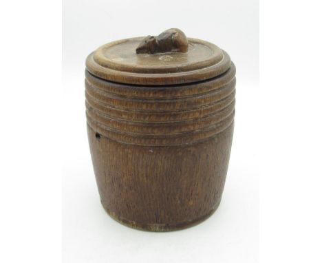 Robert Mouseman Thompson - turned oak biscuit barrel, cylindrical body with reeded frieze, the lid with carved mouse finial, 