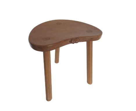 Robert Mouseman Thompson - oak cow stool, kidney shaped top on three outsplayed octagonal tapering supports, carved with sign