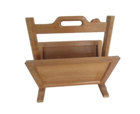 Robert Mouseman Thompson - oak magazine rack with pierced handle on octagonal supports and sledge feet, carved with signature