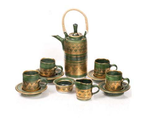 Mary Rich (b.1940) Miniature tea set painted green and gold  comprising teapot, five cups and saucers, milk jug, and sugar bo