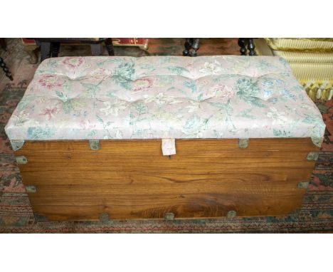 TRUNK, 50cm H x 108cm W x 53cm D, late 19th /early 20th century, teak and metal bound with later pink floral padded top. 