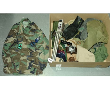 A quantity of loose Military Uniform circa 1970's 1980's which includes camouflage jackets, belts and similar along with a Ch