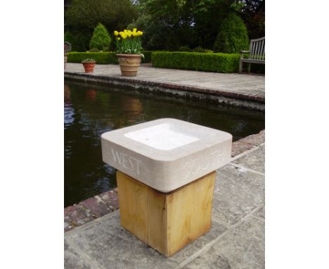 Will Spankie (b.1967) Compass birdbath Purbeck stone and oak plinth, 2018 45cm high x 40cm across. Horatio's Garden will rece