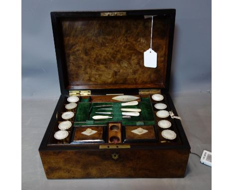 A Victorian burr walnut sewing box by Parkins &amp; Grotto, with fully fitted interior and mother of pearl implements, H.13 W