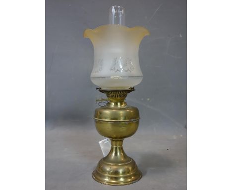A Victorian brass oil lamp, with glass chimney and frosted peach glass shade etched with Art Nouveau motif, H.54cm 