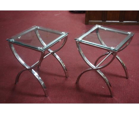 A pair of contemporary chrome lamp tables with glass tops, H.60 W.50 D.50cm 