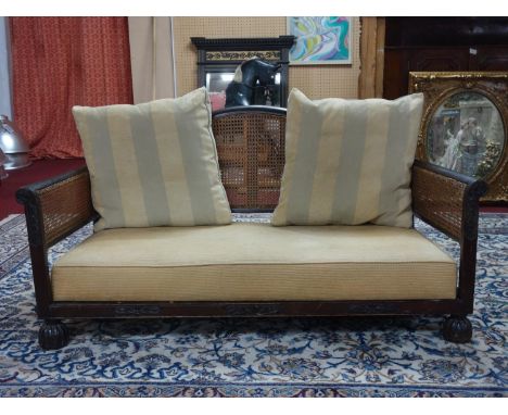 An Edwardian mahogany bergere sofa 