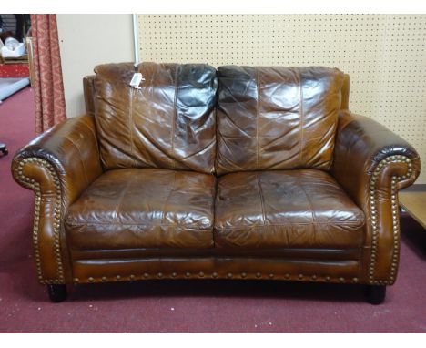 A Howard style stud bound leather sofa 