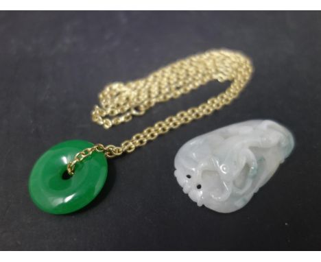 A Chinese jade pendant together with a Chinese carved jadeite pendant 