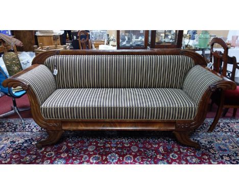 A Regency mahogany sofa with outswept acanthus scrolling arms raised on swept supports, H.94 W.214 D.67cm 