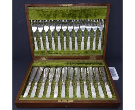 A set of 12 late 19th/early 20th century silver plated fish knives and forks, with mother of pearl handles and silver collars