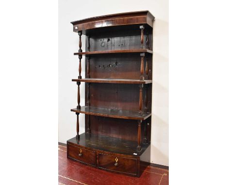 A 19th Century Mahogany Four-Tier Bowfronted Hanging Shelf, fitted with two base drawers, 61cm by 27cm by 109cm