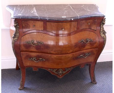 A Reproduction French Walnut Commode, of bombe form, with gilt metal mounts and marble top, 106cm by 52cm by 85cm