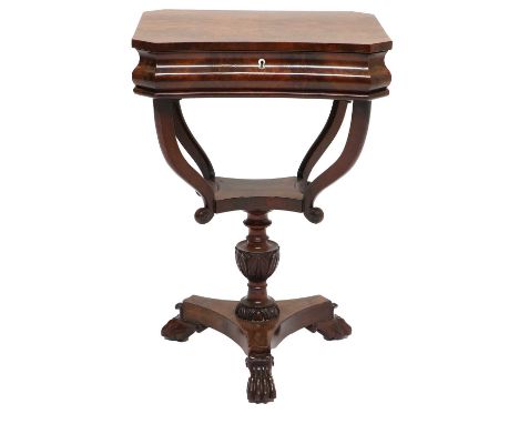 A Mid 19th Century North European Mahogany Work Table, of concave shaped form, the quarter-veneered hinged lid enclosing a fi