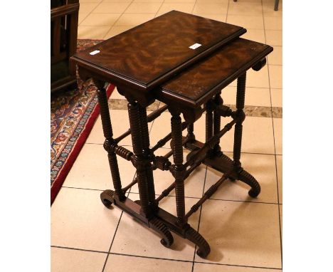 Theodore Alexander, a pair of figured walnut nesting tables with crossbanded quarter veneered tops, over Regency sytle bobbin