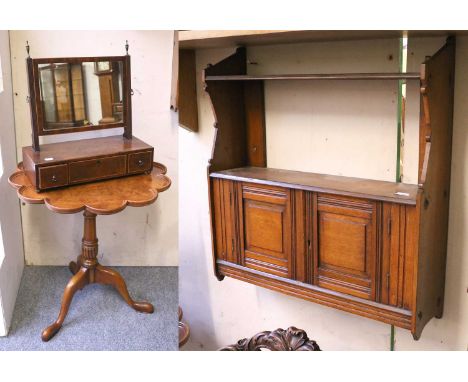 A Reproduction Burr Walnut Supper Table, in George III style, the lobed and dished top, rotating on a bird cage mechanism on 