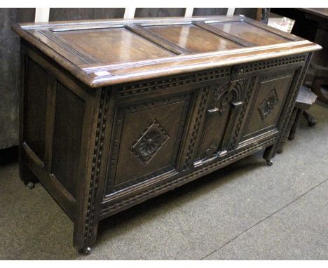 A 20th Century Oak Three Panel Coffer, 122cm by 48cm by 65cmOverall in good condition, with key and functioning lock, the cas