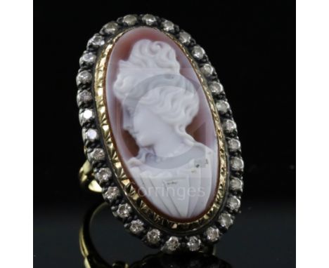 An 18ct gold, sardonyx hardstone cameo and diamond set oval dress ring, the stone carved with the bust of a lady to dexter, w