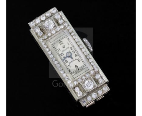 A lady's 1930's 18ct white gold and diamond set Rolex manual wind cocktail watch, the rectangular Arabic dial inscribed Rolex