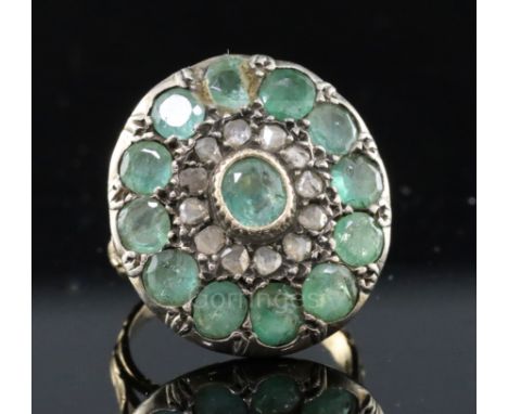 A 19th century style gold, emerald and rose cut diamond set target cluster dress ring, with carved shank and setting, size H.