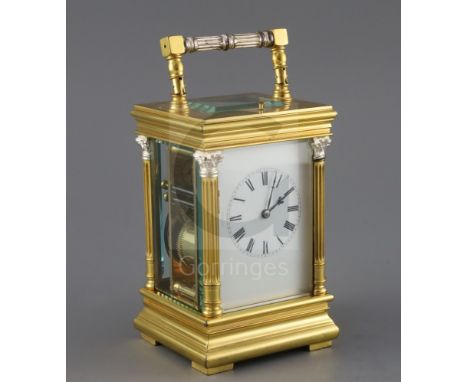 An early 20th century French gilt brass quarter-repeating carriage clock, striking on two gongs, with enamelled Roman dial an