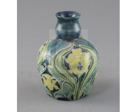 A Moorcroft Florian ware small vase, c.1902-5, decorated predominantly in green, blue and yellow with daffodils and other flo