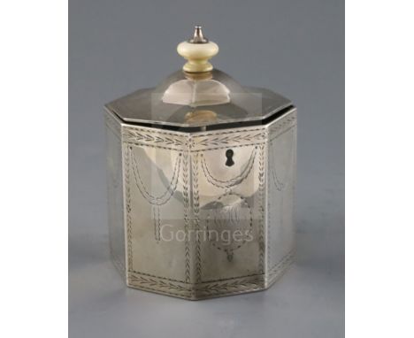 A George III silver octagonal tea caddy by William Turton, with turned ivory finial, engraved decoration and later engraved i