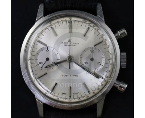 A gentlemans 1960's stainless steel Breitling Top Time manual wind wrist watch, the silvered dial with baton numerals and two