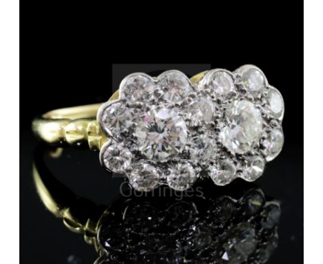 An 18ct yellow gold, platinum and diamond double cluster ring, approx 2.2ct total, size N.