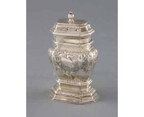 A late George I silver narrow bombe shaped tea caddy, with later embossed foliate decoration and engraved crest, no makers ma