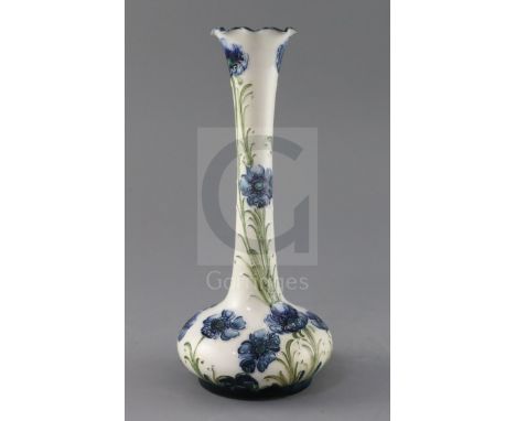 A Moorcroft Florian ware 'blue poppy' vase, Rd. no. for 1902, the blue poppies on a cream ground, brown printed mark and RD n