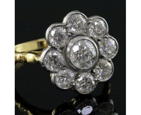 An 18ct gold and diamond cluster flowerhead ring, with a total diamond weight of approximately 2.10cts, size N.