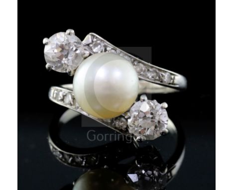 A modern white gold, natural pearl and two stone diamond crossover ring with diamond set shoulders, and CISGEM certificate da