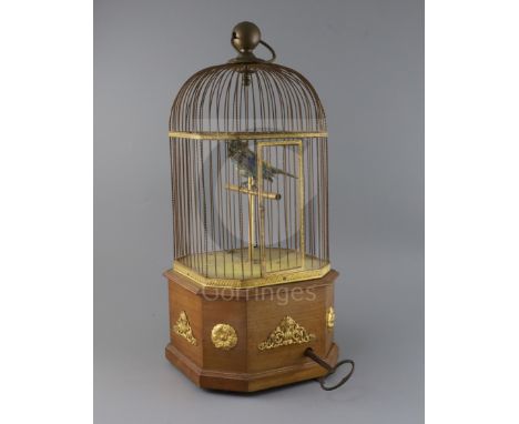 An early 20th century Swiss gilt metal mounted mahogany singing bird in a cage automaton, H.21in.