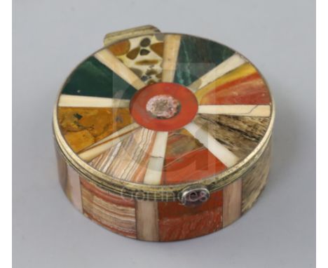 A 19th century continental silver gilt and multi hardstone segmented circular snuff box and cover, with garnet set button, un