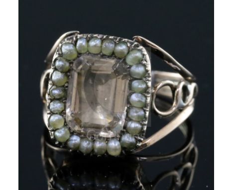 A Georgian gold and foil backed paste and seed pearl set ring, size I/J.