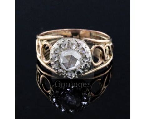 A Georgian gold, silver and rose cut diamond set cluster dress ring, with reeded and pierced shank, size M.