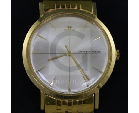 A gentleman's 1960's? 18k gold Jaeger LeCoultre manual wind dress wrist watch, with baton numerals, on an associated 18k gold