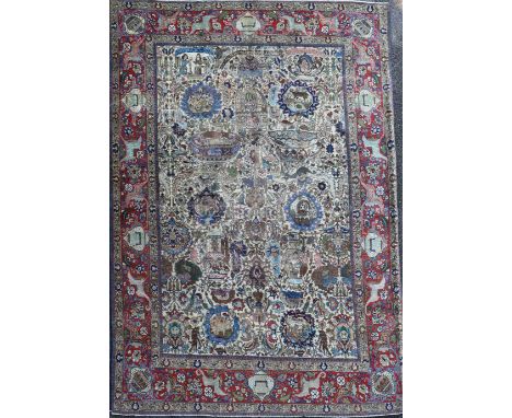 A Tabriz picture carpet, with field of figures, animals, vases, birds etc. on an ivory ground, with three row border, 10ft 11