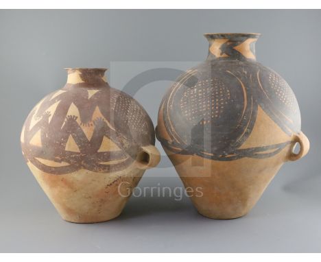 Two Chinese terracotta two handled jars, Neolithic period or later, the largest decorated in black pigment and the smaller in