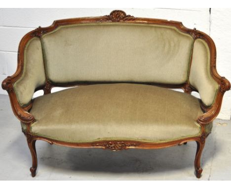 An Edwardian small walnut salon sofa upholstered in pale green velvet, length 120cm.