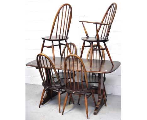 An Ercol dining table and six matching chairs (5+1), length 153cm.