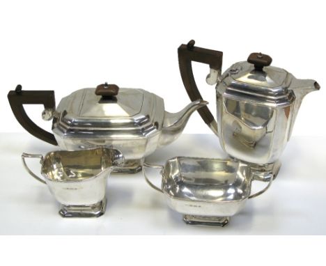 A George VI hallmarked silver four piece tea service to include tea pot, hot water jug, milk and sugar, Birmingham 1939, appr