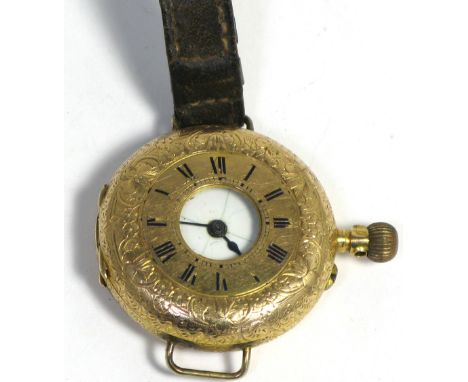 A Continental 14ct gold wristwatch, the enamel dial set with Roman numerals on leather strap (af), approx weight 25g.