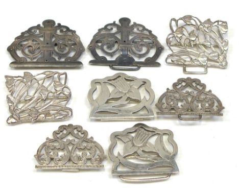 Four hallmarked silver nurses buckles to include two Art Noveau style examples, various hallmarks, combined approx weight 5.1