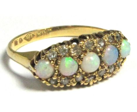 An 18ct gold dress ring set with five opals and surrounded by small diamonds, size M, approx weight 3.6g.