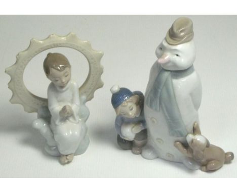 Two Nao figurines; "Winter Games", 18cm and "Jesus Loves You", 15cm, both with original boxes (2).