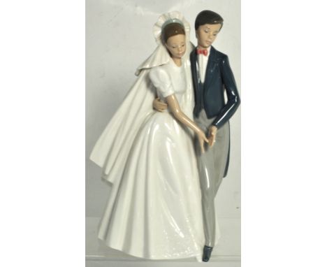 A Nao figure group depicting a married couple, height 28cm.