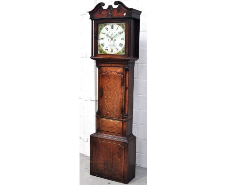 A 19th century oak longcase clock, the dial set with Roman numerals and bearing the name W.Hughes Birmingham, with foliate de