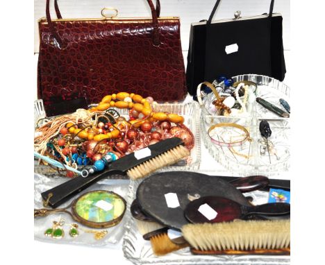 A quantity of costume jewellery to include necklaces, bracelets, hat pins etc, a silver comb case, a silver handle manicure i